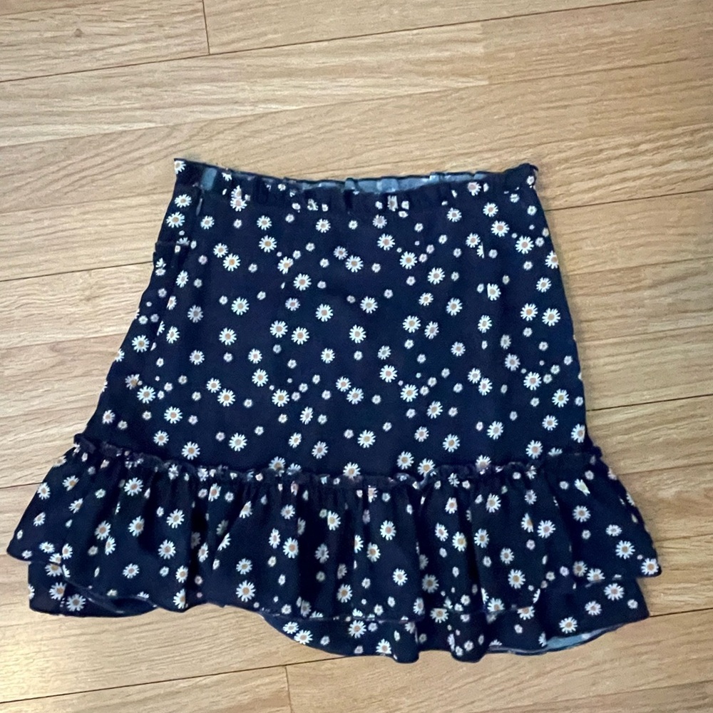 Navy blue skirt with dandelions.